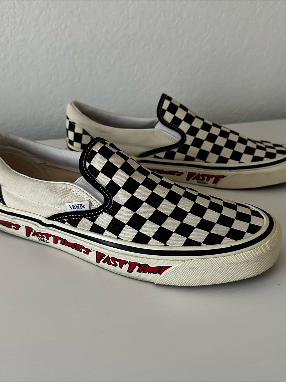 Vans “Fast Times” Checkerboard Slip-On Sneakers